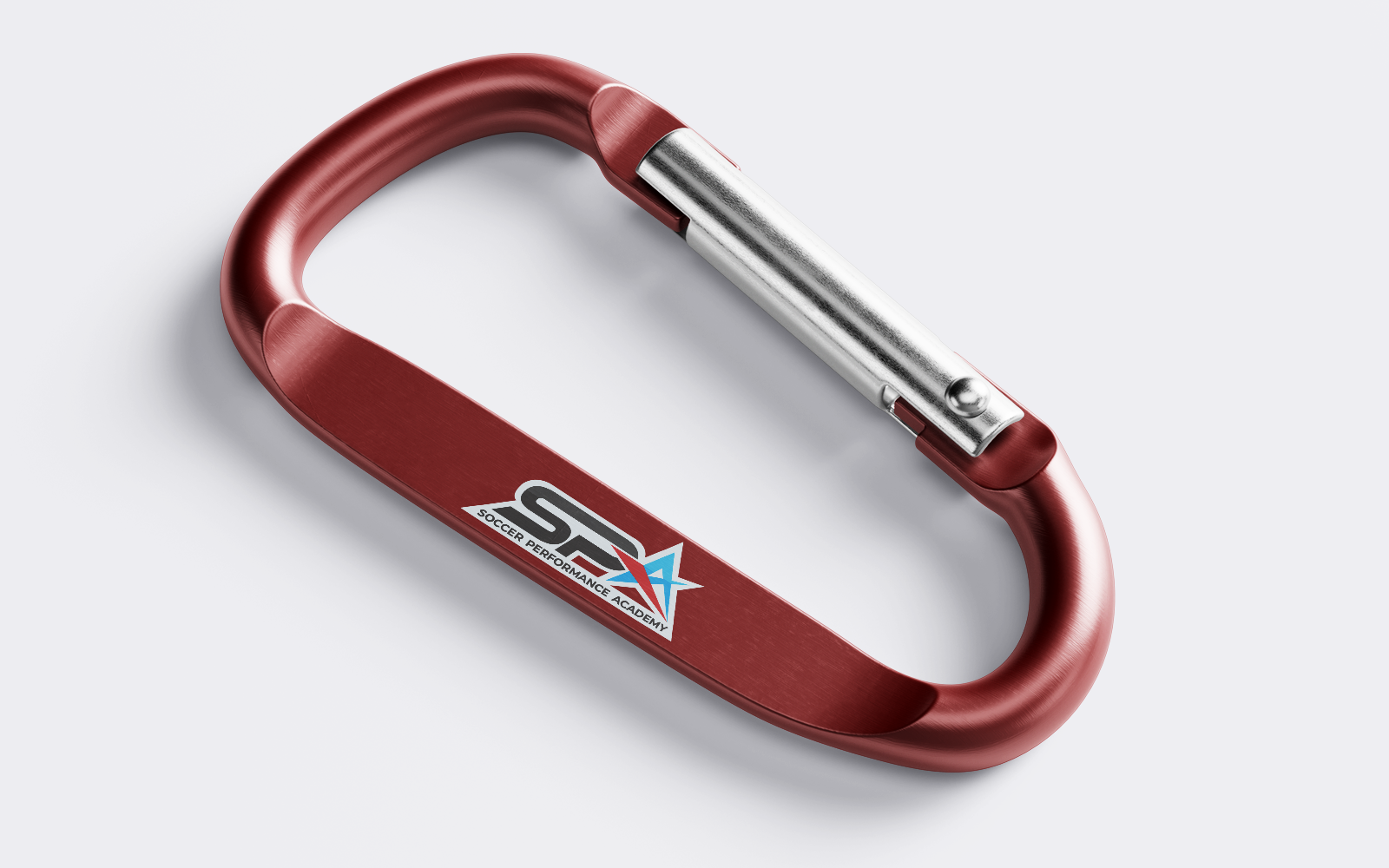Branded carabiner for Soccer Performance Academy created by RE agency