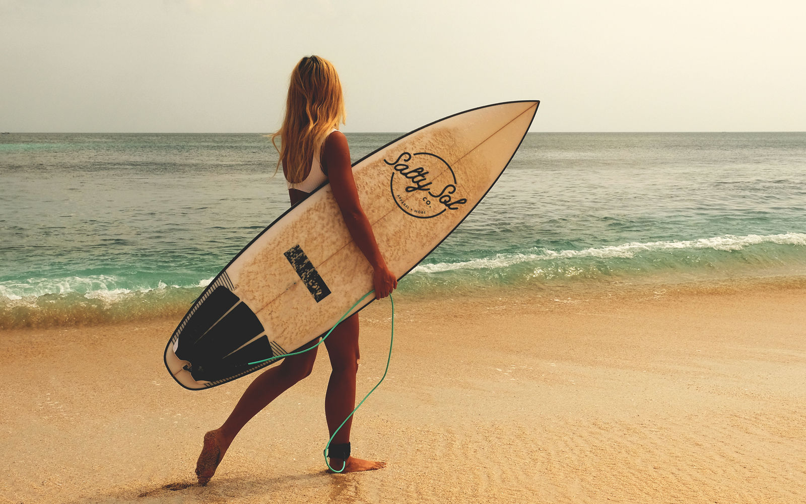 Branded surf board for Salty Sol apparel company by RE agency