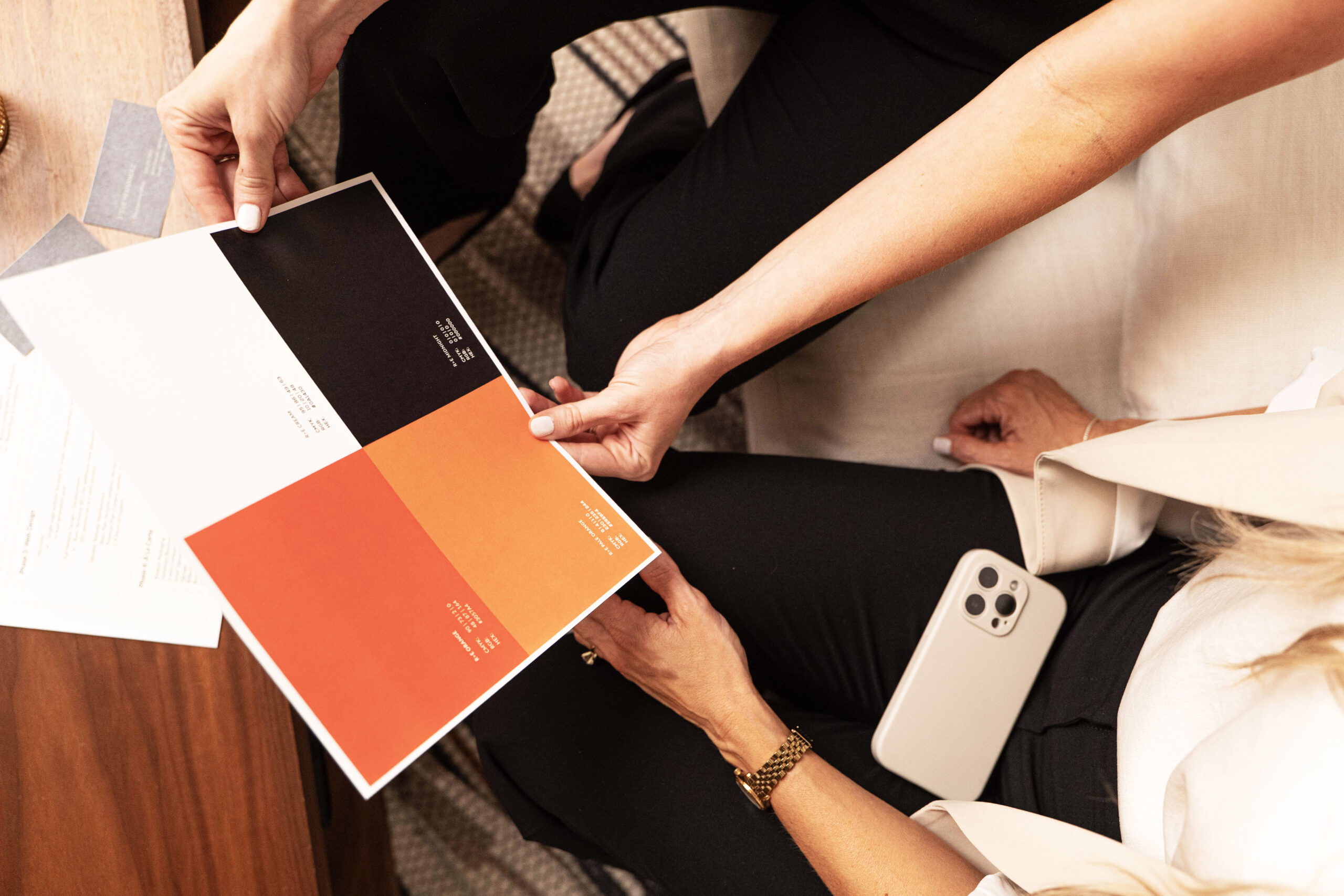 Women team holding branding materials